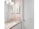 ' bathroom with single vanity, granite countertop, and fun decor at 2029 Sloans Outlook Dr, Groveland, FL 34736
