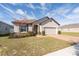 One-story home with a two-car garage at 2029 Sloans Outlook Dr, Groveland, FL 34736
