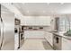 Modern kitchen with stainless steel appliances and granite countertops at 2029 Sloans Outlook Dr, Groveland, FL 34736