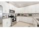 Modern kitchen with stainless steel appliances and granite countertops at 2029 Sloans Outlook Dr, Groveland, FL 34736