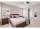 Main bedroom with king bed, ensuite bath access, and neutral decor at 2029 Sloans Outlook Dr, Groveland, FL 34736