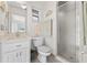 Small bathroom with a shower, toilet and white vanity at 21152 Royal St Georges Ln, Leesburg, FL 34748