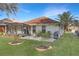 Spacious backyard with patio, landscaping, and grilling area at 21837 Royal St Georges Ln, Leesburg, FL 34748