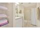 Clean bathroom with a tub, shower, and linen storage at 21837 Royal St Georges Ln, Leesburg, FL 34748