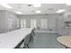 Community clubhouse craft room with large table at 21837 Royal St Georges Ln, Leesburg, FL 34748