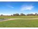 Peaceful view of a lush green golf course at 21837 Royal St Georges Ln, Leesburg, FL 34748