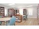 Community clubhouse library with bookshelves and tables at 21837 Royal St Georges Ln, Leesburg, FL 34748