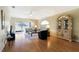 Bright living room with hardwood floors, neutral walls, and ample natural light at 21837 Royal St Georges Ln, Leesburg, FL 34748