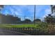 Well-maintained tennis courts with surrounding landscaping at 21837 Royal St Georges Ln, Leesburg, FL 34748