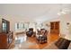 Relaxing living room featuring hardwood floors and comfortable seating at 26500 Wimbledon St, Leesburg, FL 34748