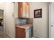 Convenient bar area with granite countertops, wine rack, and built-in beverage cooler at 2709 Astoria Ave, The Villages, FL 32162