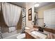 Comfortable bathroom featuring a vanity with a granite countertop, framed mirror, a shower and bathtub combo at 2709 Astoria Ave, The Villages, FL 32162