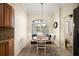 Cozy dining area with natural light, stylish furnishings, and chandelier at 2709 Astoria Ave, The Villages, FL 32162