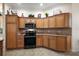 Modern kitchen with stainless steel appliances, ample cabinet space, and tile backsplash at 2709 Astoria Ave, The Villages, FL 32162