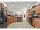 Spacious kitchen with stainless steel appliances, granite countertops, and tile flooring at 2709 Astoria Ave, The Villages, FL 32162