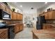 Bright kitchen with granite countertops, stainless steel appliances, and eat in nook at 2709 Astoria Ave, The Villages, FL 32162