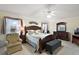 Serene main bedroom with a king-size bed, soft lighting, and elegant furnishings at 2709 Astoria Ave, The Villages, FL 32162