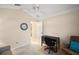 Bright, airy office space with a ceiling fan and crown moulding is ready to personalize at 2709 Astoria Ave, The Villages, FL 32162