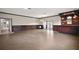 Finished basement with custom bar, wainscoting, tile flooring, and access to the outdoor pool at 29319 Old Mill E, Tavares, FL 32778