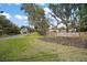 Beautiful community entrance featuring lush green lawns and a stone sign reading 'Old Mill Run' at 29319 Old Mill E, Tavares, FL 32778