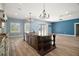 Kitchen with island, stone countertops, stainless steel appliances, and breakfast bar at 29319 Old Mill E, Tavares, FL 32778