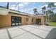 Large outdoor patio features access to home via multiple French doors and outdoor lighting at 29319 Old Mill E, Tavares, FL 32778