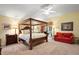 Spacious Primary bedroom with a king-size bed and access to the patio at 3201 Darien Way, The Villages, FL 32162