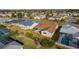 Aerial view of house, backyard, and pool; surrounded by other homes at 3236 Williams Rd, The Villages, FL 32162