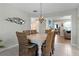 Bright dining room with a rustic table and wicker chairs at 3236 Williams Rd, The Villages, FL 32162