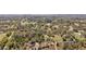 High aerial showcasing the wooded acreage, offering privacy and natural beauty at 3380 Cr 528, Sumterville, FL 33585