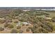 Overhead aerial perspective of the property, showing the home and surrounding wooded acreage at 3380 Cr 528, Sumterville, FL 33585