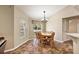 Dining area featuring wood table, backyard views, and open to the kitchen and living area at 3380 Cr 528, Sumterville, FL 33585