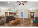 Open-concept living space with tile flooring that connects the living, dining, and kitchen areas at 3380 Cr 528, Sumterville, FL 33585
