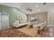Bright and spacious living room features vaulted ceilings, neutral walls, and tile flooring at 3380 Cr 528, Sumterville, FL 33585