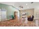 Spacious living room features tile floors, large window, and neutral color palette at 3380 Cr 528, Sumterville, FL 33585
