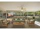 Screened in patio with ample seating, perfect for outdoor relaxation and entertaining at 3380 Cr 528, Sumterville, FL 33585