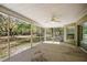 Large screened-in patio with views of the backyard and surrounding greenery at 3380 Cr 528, Sumterville, FL 33585