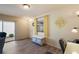 Bright entryway with wood-look floors and storage bench at 3764 Ivey Ter, The Villages, FL 32163