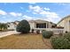 Exterior view of house with well maintained landscaping at 3764 Ivey Ter, The Villages, FL 32163