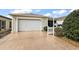 House exterior showcasing attached garage and driveway at 3764 Ivey Ter, The Villages, FL 32163