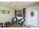 Front porch with wicker seating and a decorative wreath at 3764 Ivey Ter, The Villages, FL 32163