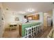 Cozy kitchen with light wood cabinets, white appliances, and a breakfast bar at 3764 Ivey Ter, The Villages, FL 32163