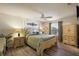 Spacious bedroom with a large bed, nightstands, and a dresser at 3764 Ivey Ter, The Villages, FL 32163