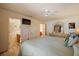 Main bedroom with a king-size bed and en-suite bathroom at 3764 Ivey Ter, The Villages, FL 32163