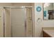 Clean shower with glass enclosure and built-in shelving at 3764 Ivey Ter, The Villages, FL 32163