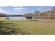 Backyard view with bench overlooking the lake at 4668 Tower Pine Rd # Ge, Orlando, FL 32839