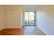 Spacious bedroom with double doors leading to patio at 4668 Tower Pine Rd # Ge, Orlando, FL 32839