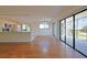 Bright dining area with wood flooring and sliding glass doors to patio at 4668 Tower Pine Rd # Ge, Orlando, FL 32839