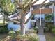 Attractive condo unit exterior with stairs and landscaping, showcasing its curb appeal at 4668 Tower Pine Rd # Ge, Orlando, FL 32839