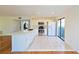 Updated kitchen featuring white cabinets, stainless steel appliances, and a breakfast bar at 4668 Tower Pine Rd # Ge, Orlando, FL 32839